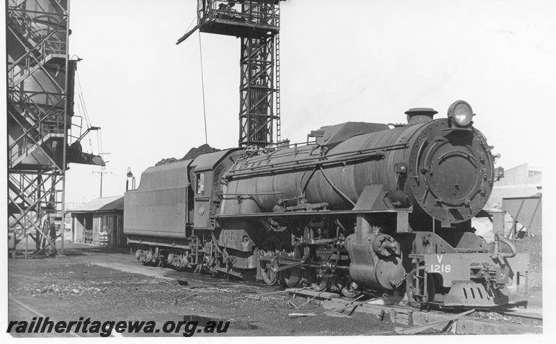 P17087
V class 1218 steam locomotive, front and side view at East Perth loco with coal stage to left. ER line
