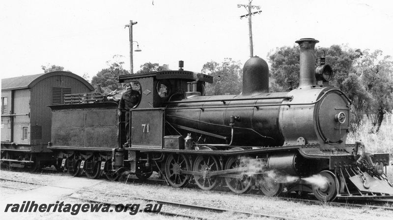 P17140
G class 71 locomotive at Yarloop. Front & side view of loco and portion of Z class brakevan attached to loco. SWR line.
