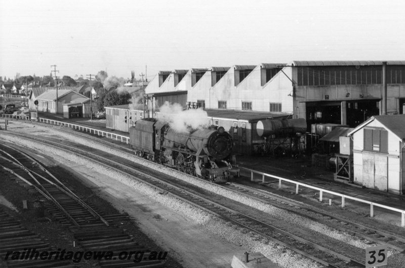 P17149
V class 1205 locomotive at East Perth. Note loco sheds to right and construction of standard gauge trackage at East Perth Terminal to left. ER line.
