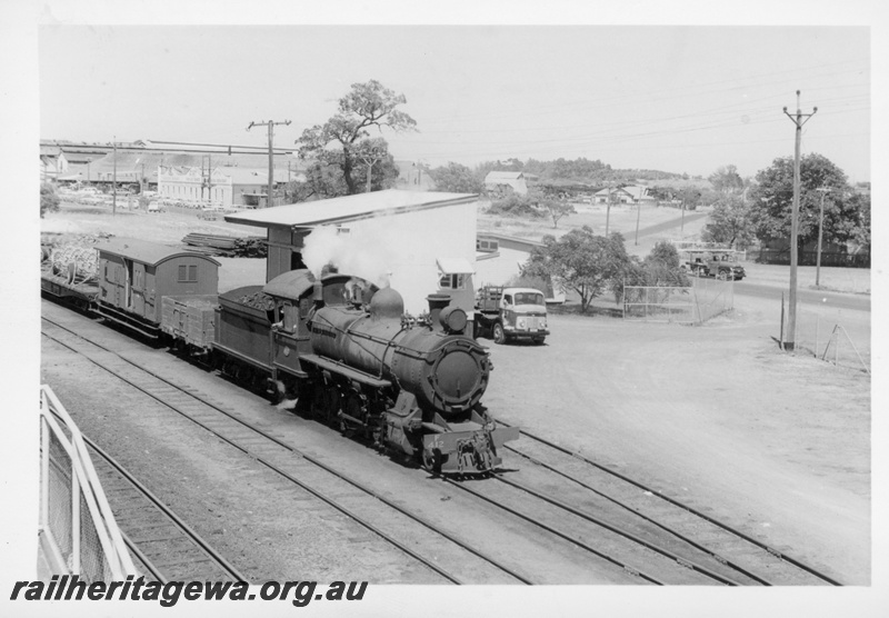 P17161
F class 412 steam locomotive, side and front view, shunting at Bassendean, goods shed with side window, ER line.
