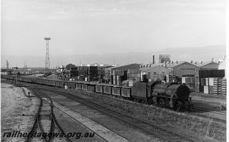 P17170
V class steam locomotive side and front view on the number 56 train of empties coming into Leighton, tracks, points, cheese knob, light tower, Leighton.
