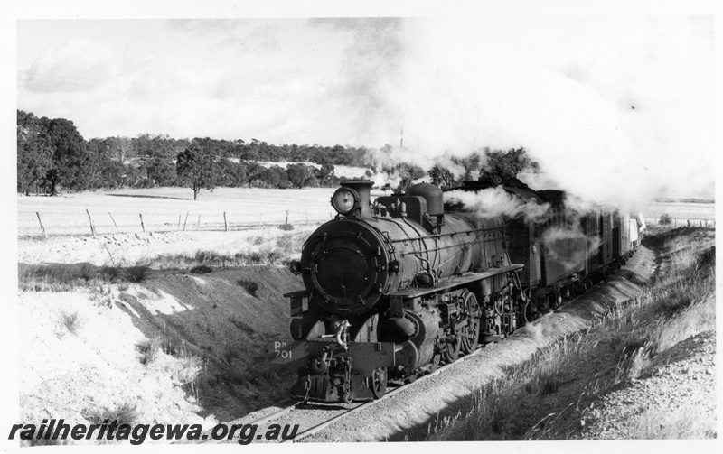 P17374
PM class 701 steam locomotive on 104 goods on 'Narrogin Bank' enroute to Collie. Front & side view of locomotive. BN line.
