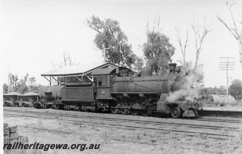P17448
FS class 452 steam locomotive hauling a loaded ballast train at Dardanup. Side view of locomotive and tender. PP line. Note J class water tanker and LA ballast wagons.
