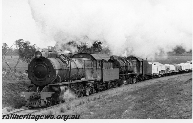 P17449
S class 548 & 542 steam locomotives hauling 104 goods. PP line. Side views of both locomotives and front view of lead locomotive. Location Unknown.
