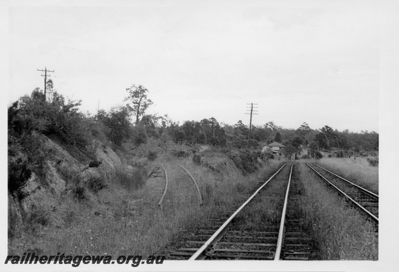 P17574
Junction of the Mundaring line (M line) and the Eastern Railway line at Mount Helena, view to the west, Mundaring line disconnected, ER line.
