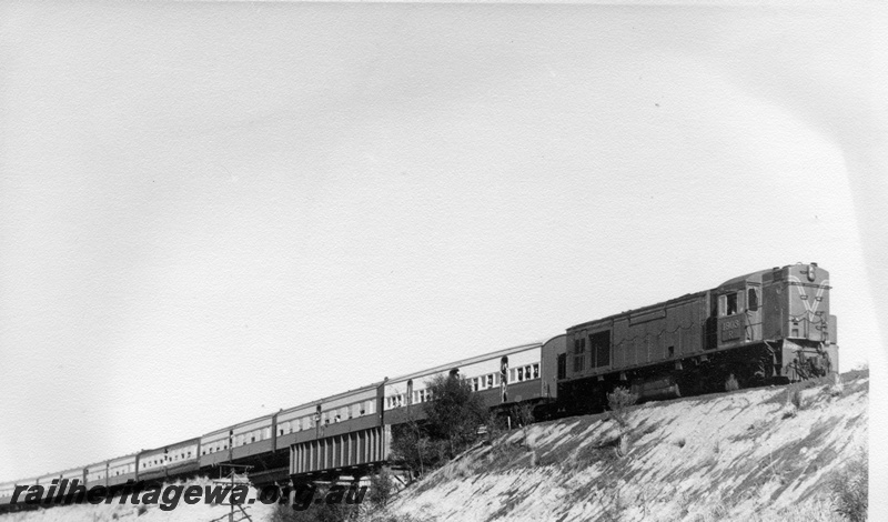 P17581
3 of 4, R class 1903 diesel locomotive on ARHS tour train to Meckering, running short end first, crossing Meenaar standard gauge flyover, EGR line.
