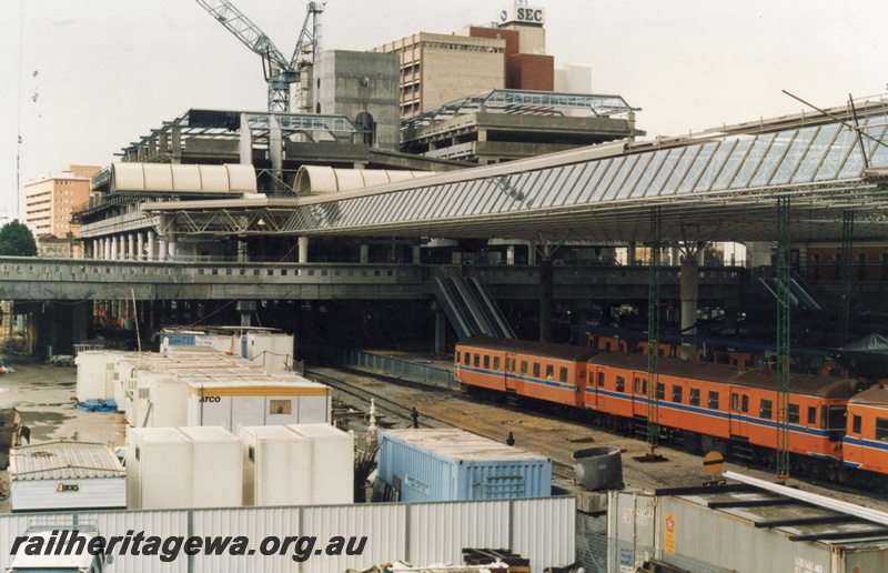 P18065
8 of 11 Construction of new Perth City station, DMUs at platforms, new escalators and pedestrian overpass, new roof, Forrest Place development in background, contractors' sheds in foreground, Perth City station

