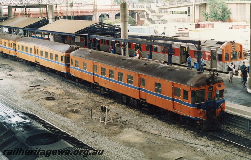 P18066
9 of 11 Construction of new Perth City station, DMU to Midland including ADG/V class 615, DMU to City, orange and stainless steel, Platforms 6 and 7, Horseshoe Bridge, roofs supports, contractors' sheds, Perth City station 
