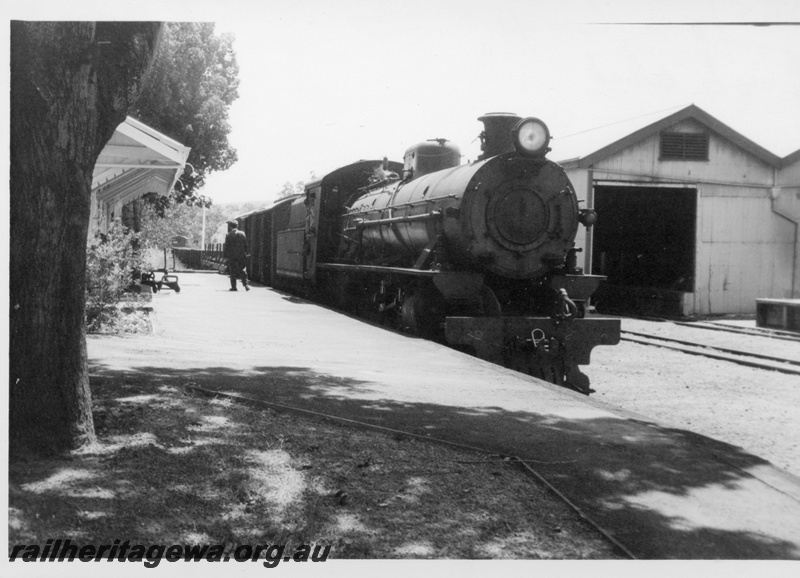 P18243
W class loco, on goods train, station building, platform, goods shed, Balingup, PP line, c1966
