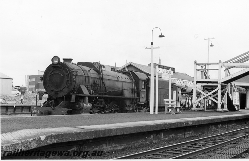 P18245
V class 1206, on No 78 goods train, platform, lamps, overhead footbridge, station building, Subiaco, ER line
