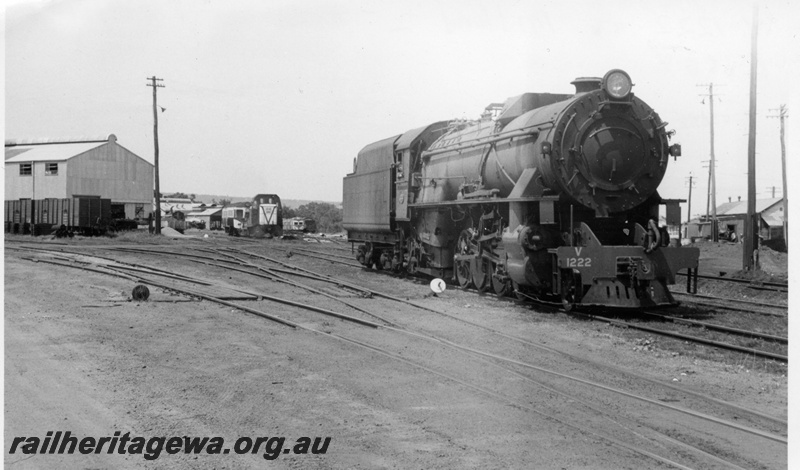 P18419
V class 1222, diesel shunter and railcars in background, shed, Midland, ER line, side and front view
