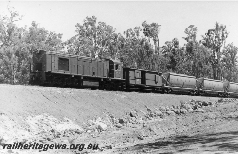 P18521
5 of 5 images of R class 1904 on bauxite service between Jarrahdale and Kwinana, empty bauxite train on bank, loco long end leading, front and side view 
