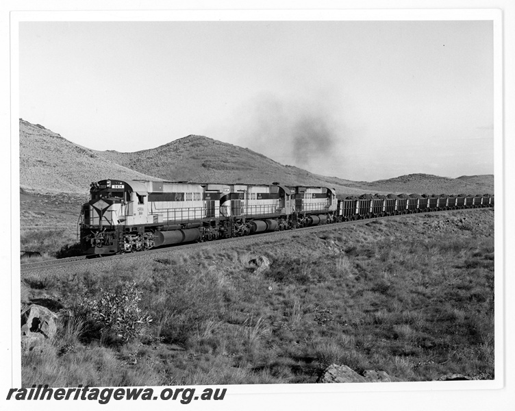 P18825
Cliffs Robe River (CRRIA) M636 class 9414, 9412, 9411 approach Siding 1 with a loaded iron ore train. 
