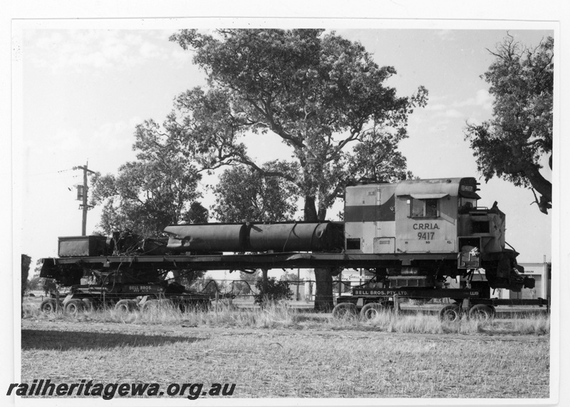 P18829
Cliffs Robe River (CRRIA) C630 class 9417 (former Chesapeake & Ohio Railroad locomotive 2100) on low loader at Gingin en route to Comeng Bassendean. This locomotive was involved in an accident on 19790222. 
