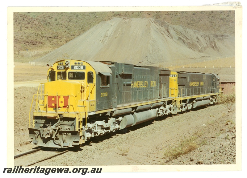 P18830
Hamersley Iron (HI) M636 class 2009, C628 class 2004 at load out tunnel Mount Tom Price. 

