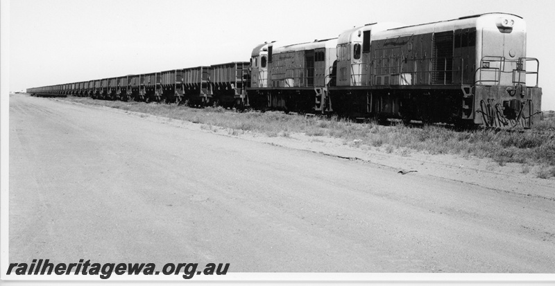 P18835
Goldsworthy Mining (GML) B class 2 and 1 haul a loaded iron ore train near Finucane island. 
