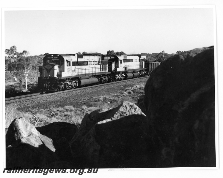 P18919
Cliffs Robe River (CRRIA) C630 class 9417, M636 class 9415 approach Siding 1 with a loaded iron ore train. Loco 9417 was formally Chesapeake & Ohio Railroad loco 2100.
