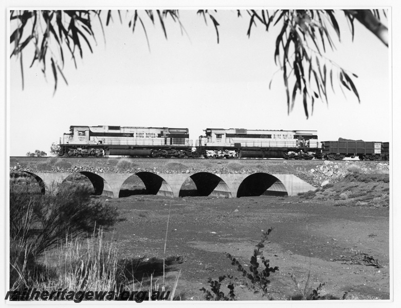 P18920
Cliffs Robe River (CRRIA) C630 class 9417, M636 class 9415 near Cape Lambert with a loaded iron ore train. Loco 9417 was formally Chesapeake & Ohio Railroad loco 2100.
