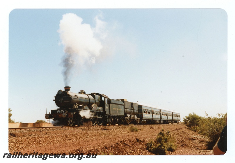 P18960
Hamersley Iron (HI) Pendennis Castle steam locomotive hauling passenger train near Dampier.
