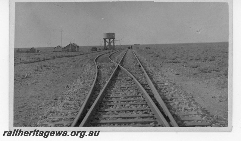 P19018
Desert siding, water tower, trackside building, TAR line, track level view 
