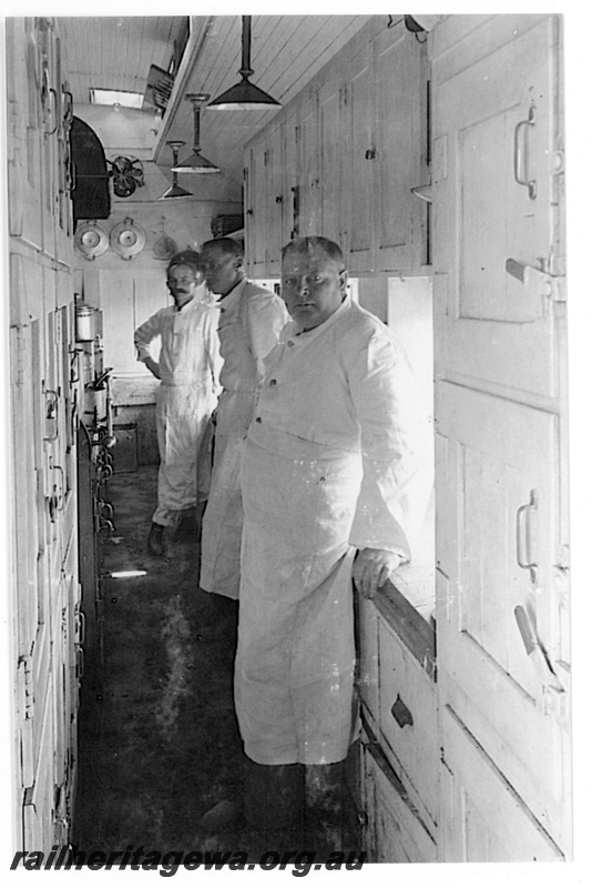 P19181
Three Commonwealth Railways (CR) galley staff, in dining car kitchen, TAR line, interior view of galley
