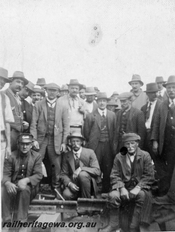 P19182
Group photo of Commonwealth Railways (CR) employees, track, TAR line, track level view
