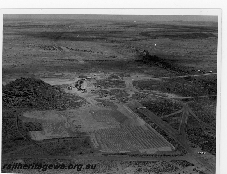 P19217
Mount Newman Mining (MNM) aerial view of Bell Bros Quarry 3. Construction of Mount Newman railway.
