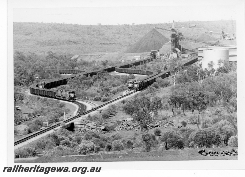 P19227
Mount Newman Mining (MNM) aerial view of Mount Whaleback mine showing 4 loaded trains.
