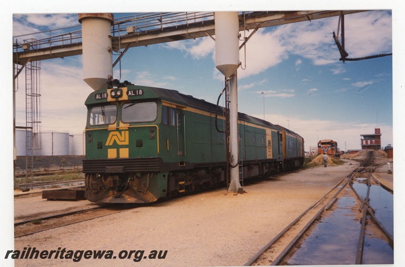P19282
Australian National AL class 18, at refuelling point, another AN diesel, Westrail diesel, control tower, tanks, tracks, Forrestfield, front and side view
