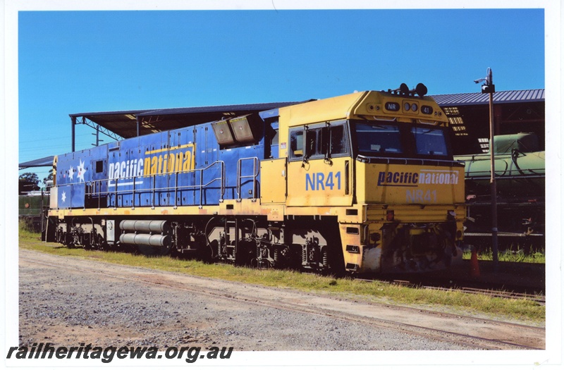 P19340
Pacific National NR class 41, yellow and blue livery, parked on the loop, Rail Transport Museum, Bassendean, side and front view
