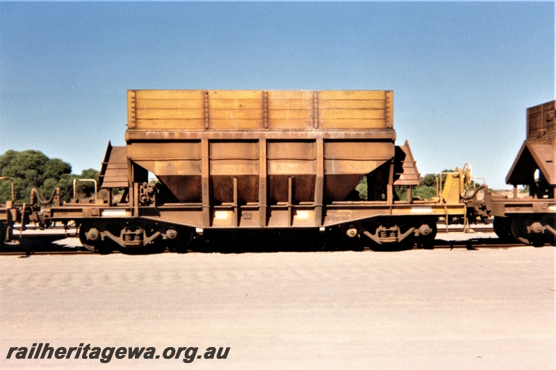 P19356
WMD class 44Y talc hopper with wooden hungry boards, yellow livery, Geraldton, NR line, side view, c1990s 
