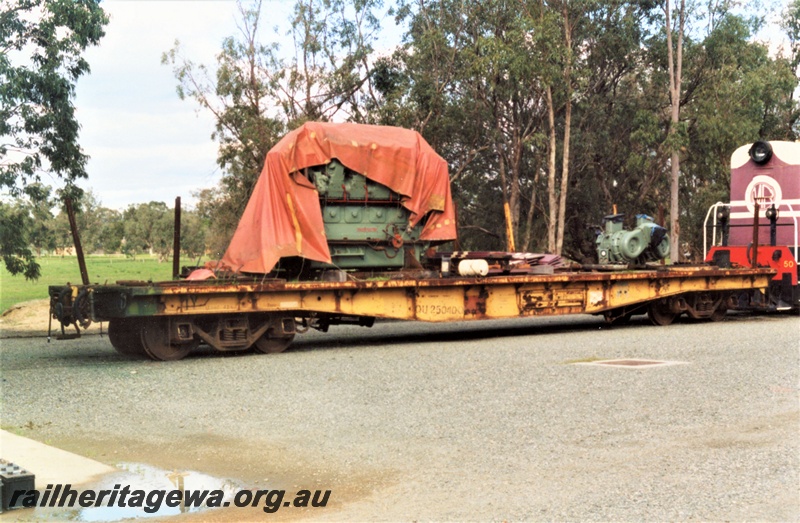 P19387
QU class 25040 flat wagon, yellow livery, Pinjarra yard, diesel engine under a tarpaulin on the deck, end and side view
