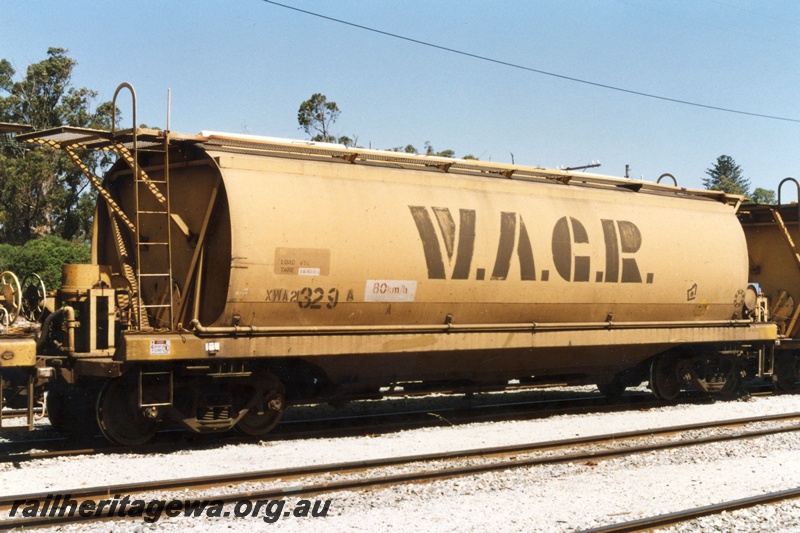 P19390
XWA class 21362 grain hopper, yellow livery with large lettered WAGR on the side, Kwinana, end and side view
