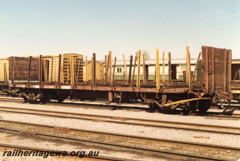 P19391
QCS class Sleeper Wagon, stanchions and end bulkheads, brown livery, Forrestfield Yard, side and end view
