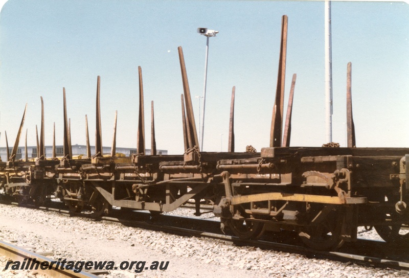 P19392
QBB class flat wagons with bolsters and stanchions, brown livery, Forrestfield Yard, side and end view
