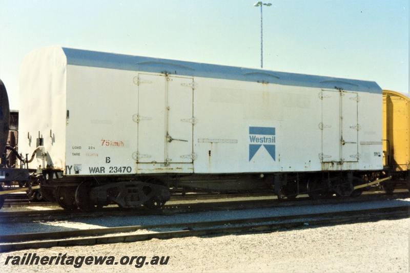 P19394
WAR class 2347017 refrigerated van, white livery with grey roof and a blue Westrail logo in the centre of the side, end and side view
