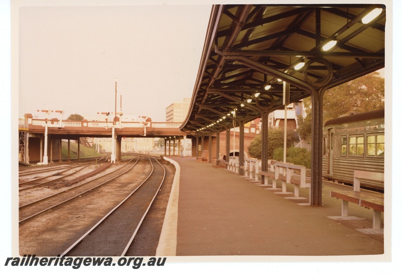 P19499
DMU (part), platform, seats, canopy, bracket signals, signal, road overpass, Perth city station, view looking east from platform
