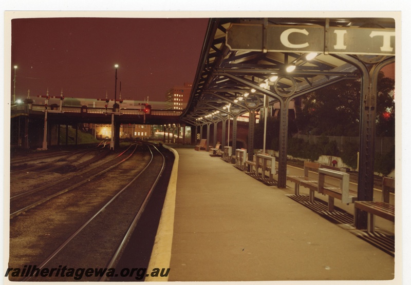 P19500
Platform, seats, lights, canopy, bracket signals, signal, road overpass, Perth city station, night view looking east 
