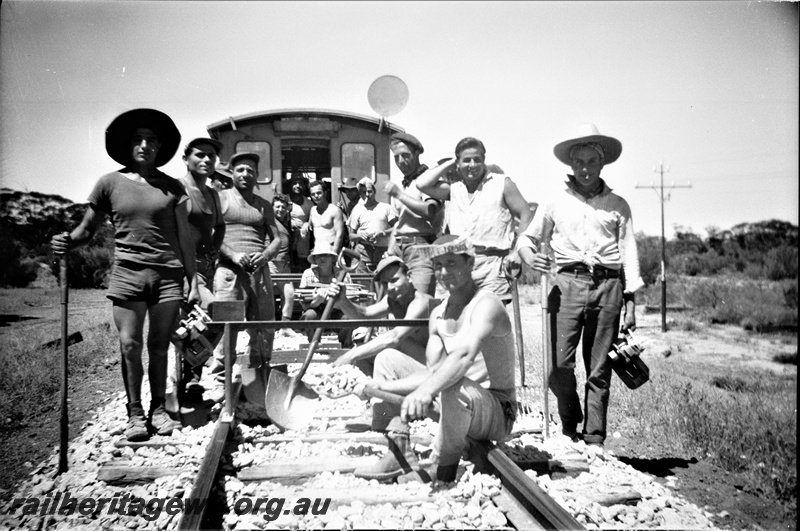 P19510
5 of 6 images of rail maintenance crew on EGR line, full crew photo, tools, track spacing gauge, note lack of special work clothing
