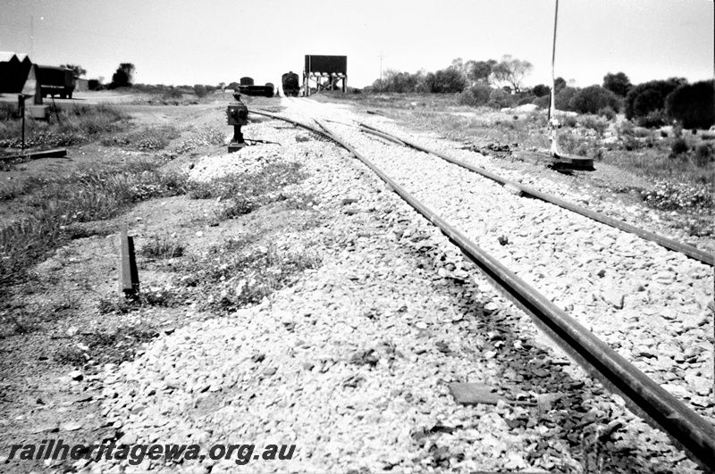 P19526
PM class loco, used for ballasting on EGR upgrade, at water tower, newly ballasted track, siding, temporary ballasting camp, point indicator, Karalee, EGR line, trackside view looking east, c late 1950s
