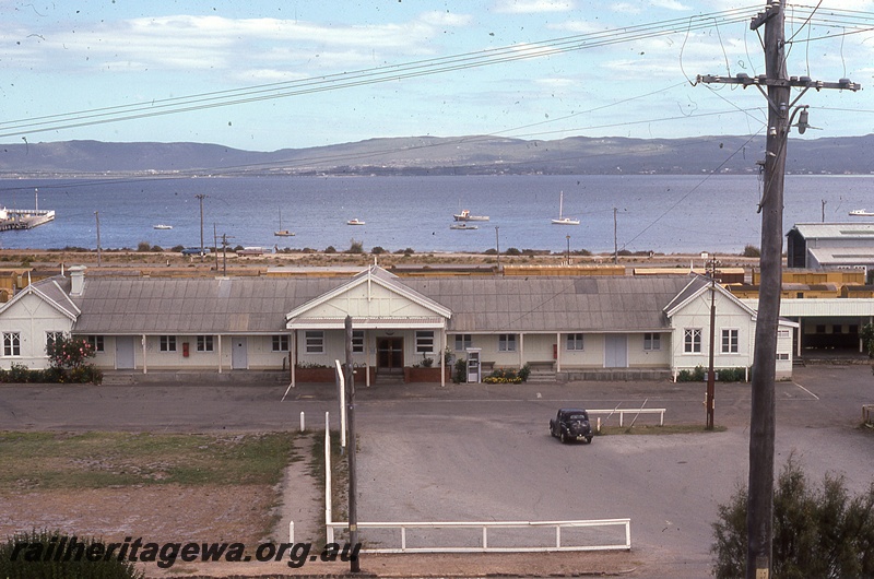 P19830
Station building, carpark, harbour in background, Albany, GSR line, view of faade from road side
