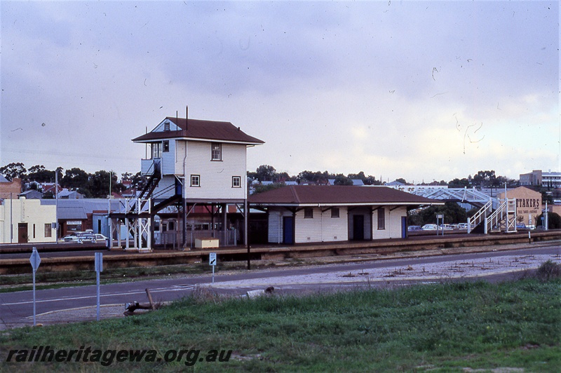 P19854
Station building, signal box, platform, pedestrian footbridge, roadway, Subiaco, ER line
