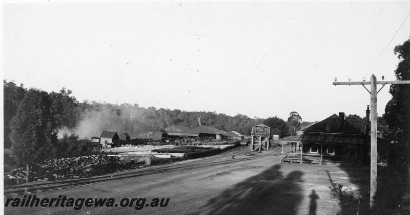 P19921
Millars Jarrahdale timber mill. View of mill. View shows a water tower with a wooden tank
