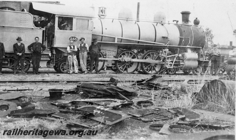 P19923
L class 255 at Midland Junction workshops after conversion from EC class locomotive. Person standing to right of  locomotive number plate is William Walsh. 
