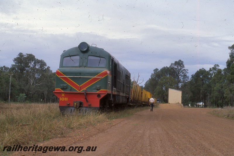 P19973
X class 1011, on goods train, station shed, platform, loading ramp, man beside train, Nannup, WN line, front and side view
