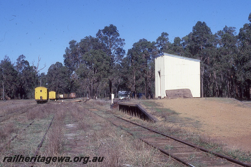 P19974
Station shed, platform, loading ramp, vans, wagons, tracks, Nannup, WN line
