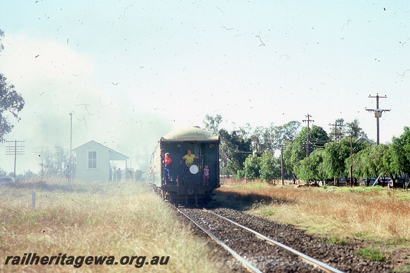 P19991
Tour train at station, tourists on rear platform of last carriage, station building, sightseers, Dardanup, PP line, view from rear of train
