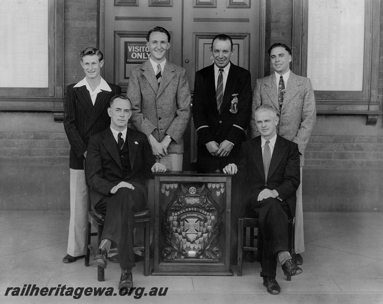 P21196
WAGR Centre St Johns Ambulance Associaation Group photo of the Champion Junior Team 1951 , Back row: W. Holloway, K. Warnock (captain), J. Perich, K. Stearne, Front row: J. Raynor (coach), J. Freer (patient)
