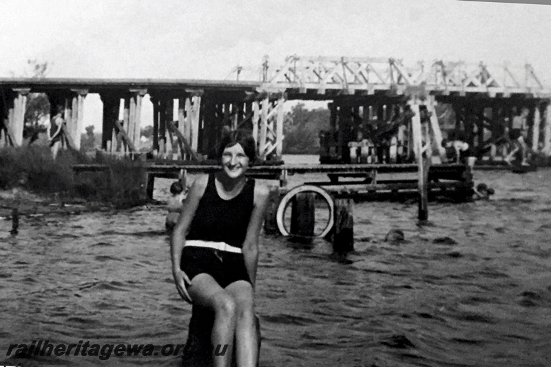 P21198
Trestle bridge with trusses over the Swan river on the Belmont Branch to the Ascot Racecourse, a teenage girl pictured in the foreground
