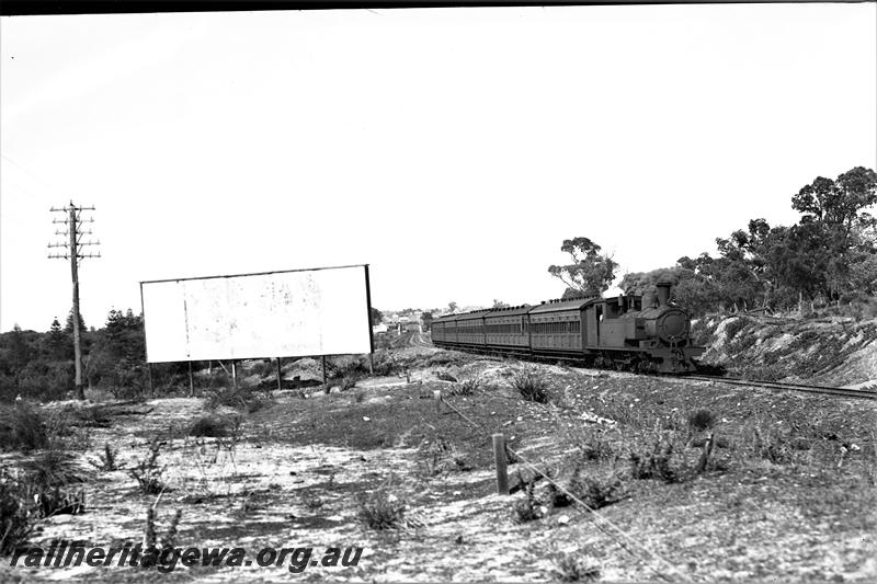 P21492
N class loco on passenger train, billboard, between Karrakatta and Shenton Park, ER line, side and front view
